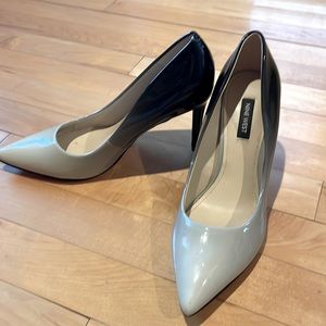 Never worn!  Heels for the office or a night out.